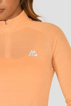 Women's Draft 1/4 Zip - Sunset Peach -Sports Clothing Store DRAFT 1 4 ZIP SUNSET PEACH logo