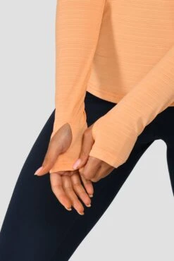 Women's Draft 1/4 Zip - Sunset Peach -Sports Clothing Store DRAFT 1 4 ZIP SUNSET PEACH sleeve detail