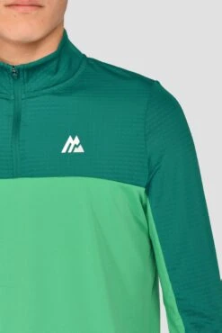 Junior Rush 1/4 Zip - Mountain Meadow/Deep Sea 11 Junior Rush 1/4 Zip - Mountain Meadow/Deep Sea -Sports Clothing Store RUSH 1 4 ZIP MOUNTAIN MEADOW DEEP SEA close logo